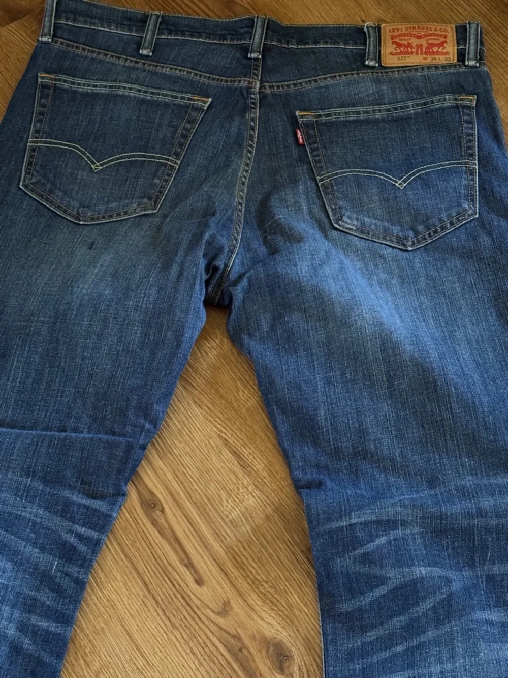 Levi's Blue Bootcut Jeans with Faded Whiskering 527